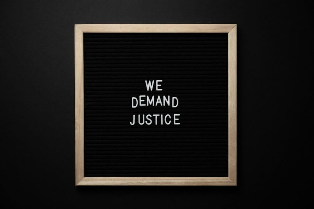 We demand justice sign