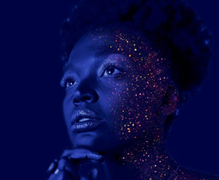 Black woman with glitter on face