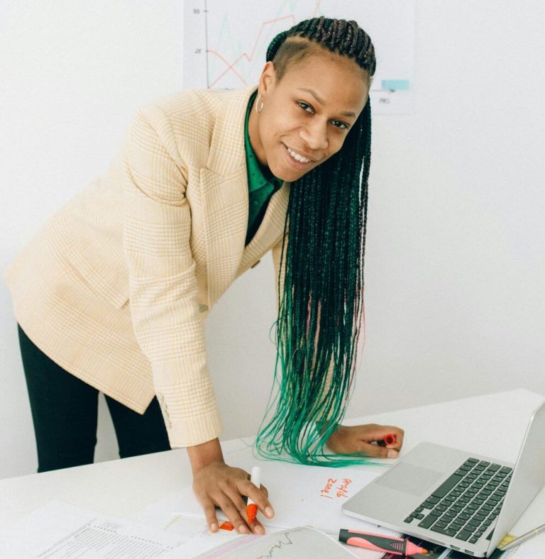Woman in workwear smiling